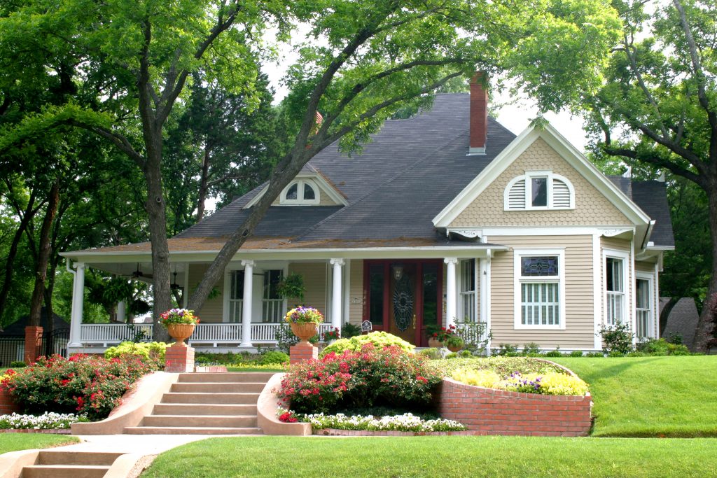 renting vs owning, traditional house, colorful flowers, neighborhood